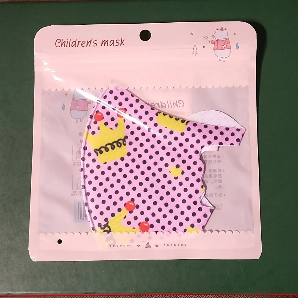 Children's re Usable face mask new in package never opened
